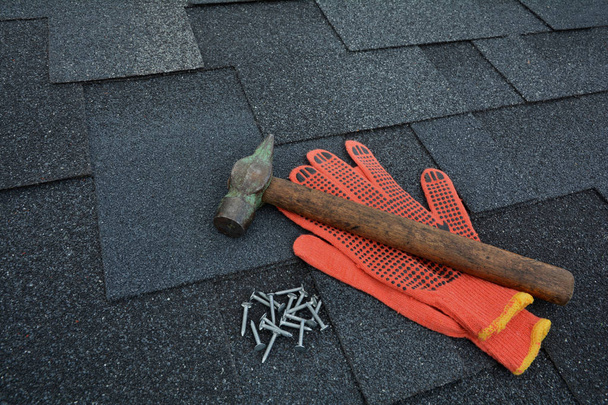 Asphalt Roofing Shingles Background. Roof Shingles - Roofing. Asphalt Roofing Shingles Hammer, Gloves and Nails - Photo, Image