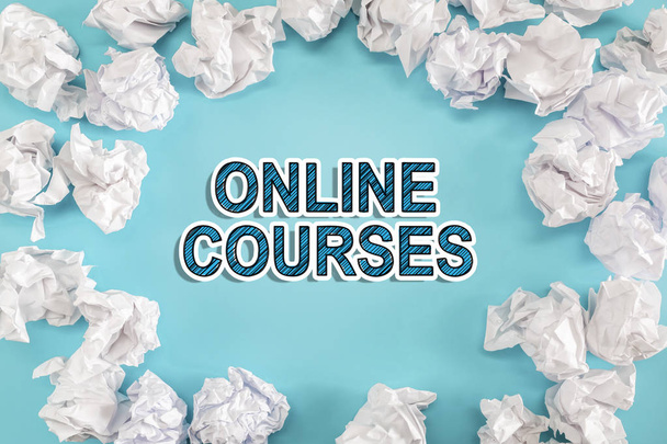 Online Courses text with crumpled paper balls  - Foto, Imagen