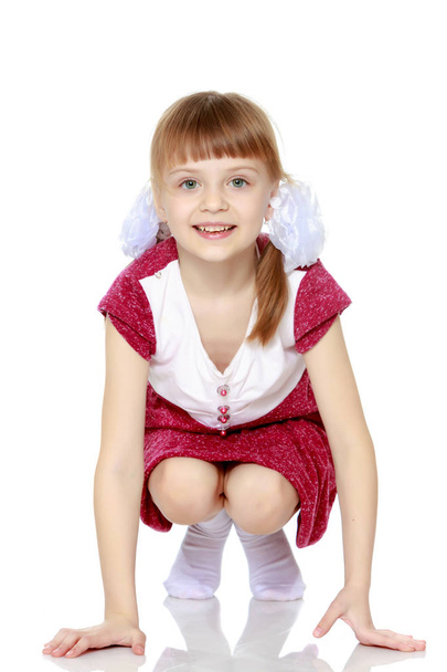 Little girl in a red dress. - Foto, Imagem