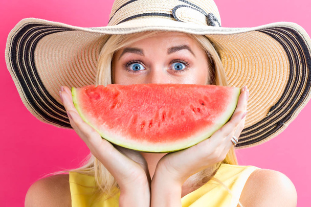 Happy young woman holding watermelon - Φωτογραφία, εικόνα