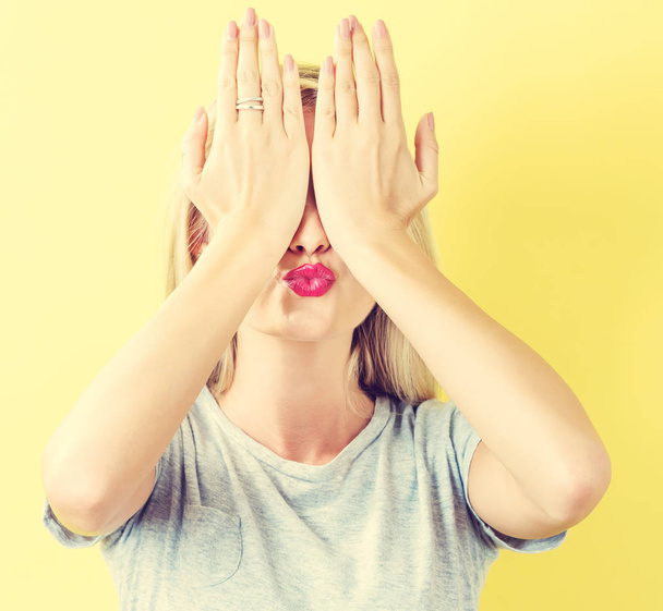 Woman covering her eyes with her hands - Photo, image