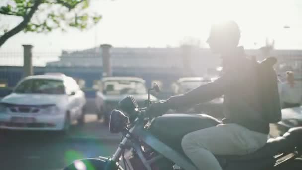 man riding motorcycle on city - 映像、動画