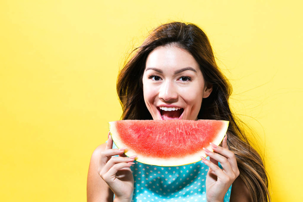  Happy young woman holding watermelon - Zdjęcie, obraz