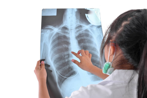 Back of doctor holding x-ray film on white. - Fotoğraf, Görsel