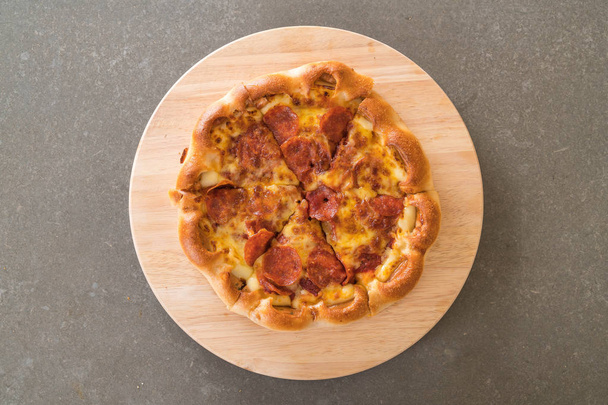 Homemade Pepperoni Pizza on wood plate - Fotó, kép