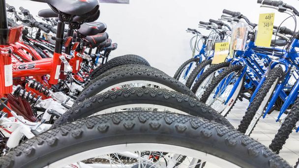 Eskisehir, Turkey - June 05, 2017: Closeup of bicycle wheels focused on tire in Carrefour supermarket in Eskisehir, Turkey - Foto, Imagen
