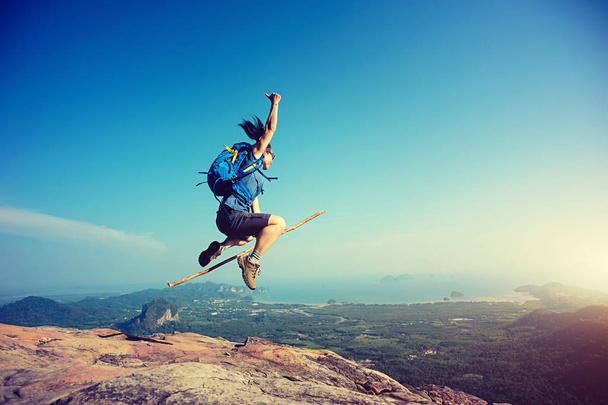 woman jumping on mountain top - Photo, Image