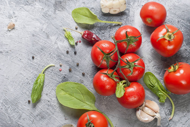 cherry tomatoes on a branch, spinach leaves and spice - Fotoğraf, Görsel