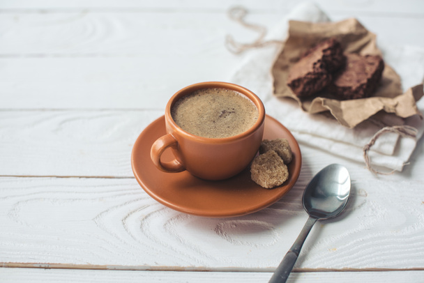 coffee with brown sugar and spoon on tabletop - Fotó, kép
