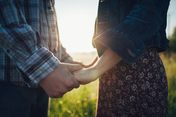 sensual couple holding hands - Fotó, kép