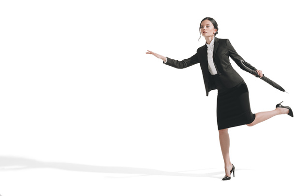 businesswoman running and holding umbrella - Photo, Image