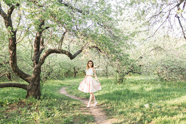Beautiful girl walks in the forest - 写真・画像