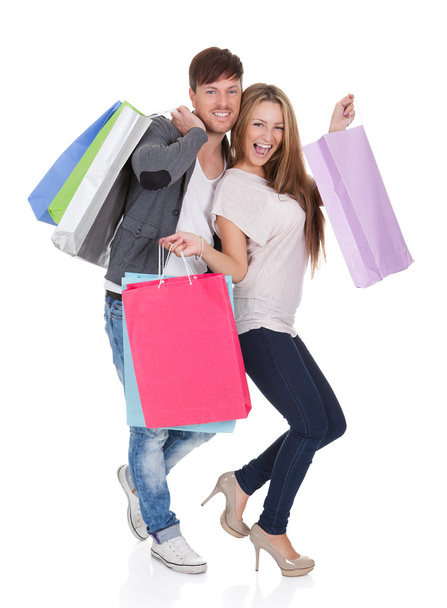 Guy and gal brings shopping bags - Photo, Image