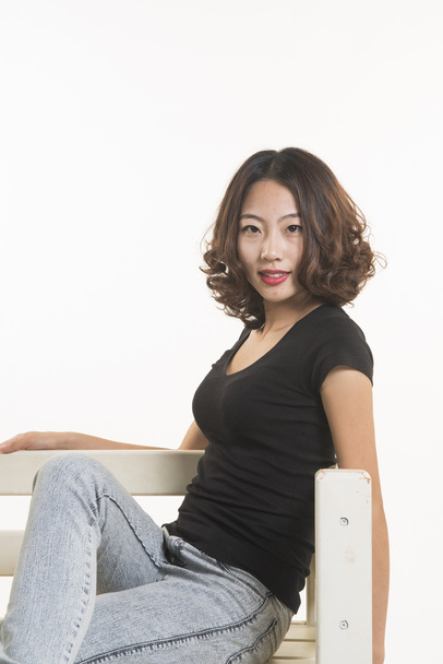 A Chinese girl sit in chair - Valokuva, kuva
