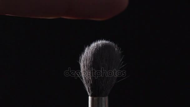 Cosmetics brush and explosion makeup powder background. - Footage, Video