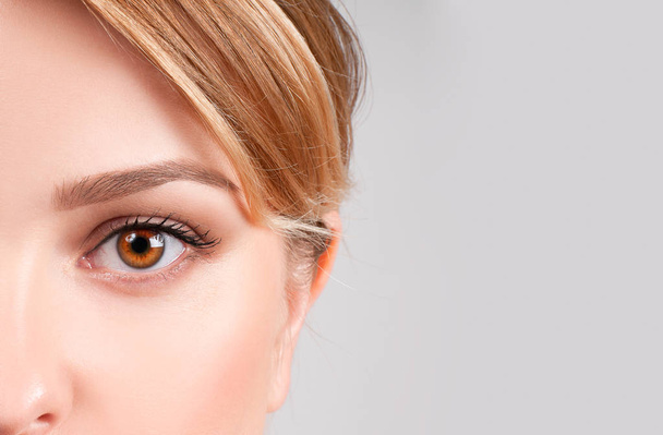 Beauty concept. Beautiful female brown eyes - Fotoğraf, Görsel