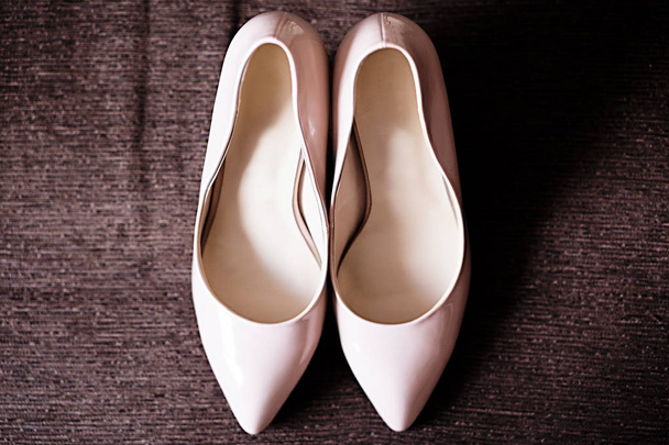 bride's shoes on the sofa. Wedding charges - 写真・画像