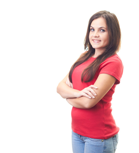 Attractive smiling young woman in red shirt standing with hands - Фото, зображення