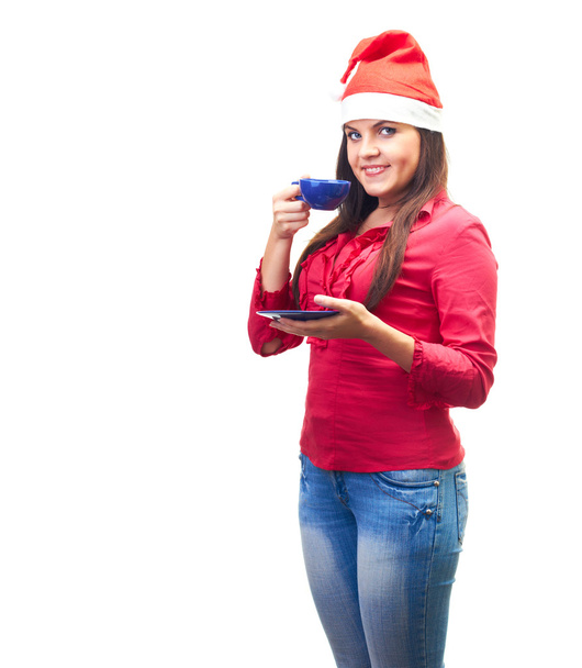 Attractive smiling young woman in a red shirt and Christmas hat - Fotó, kép