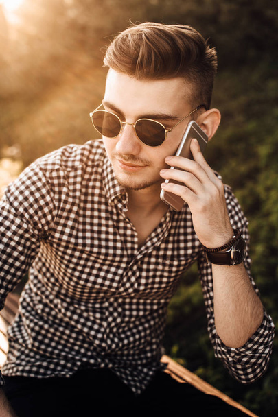 Fashionable man talk outdoors with white background street - Photo, Image