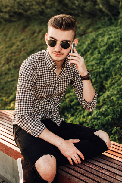 Fashionable man talk outdoors with white background street - Fotó, kép