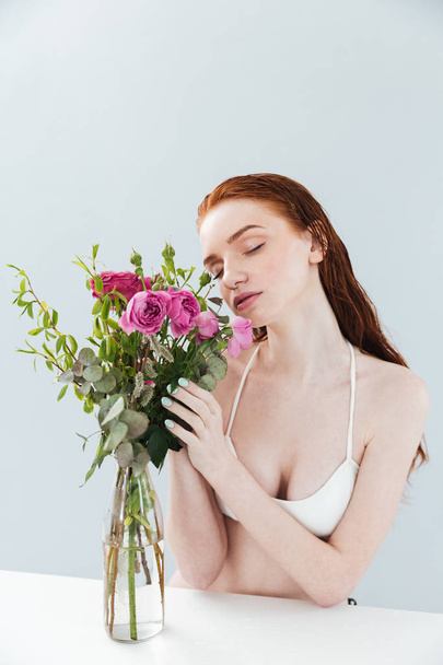 Fashion portrait of a young redheaded girl with eyes closed - Foto, Imagem