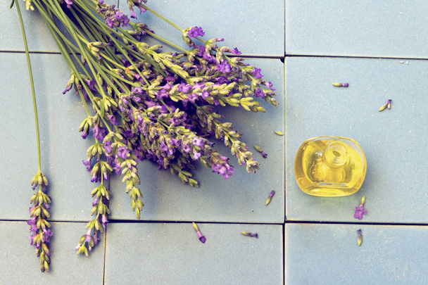 Lavender flowers on blue ceramic tiles - Photo, Image