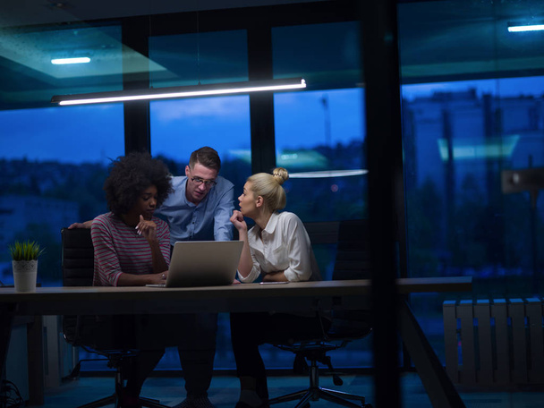 Multiethnic startup business team in night office - Photo, image