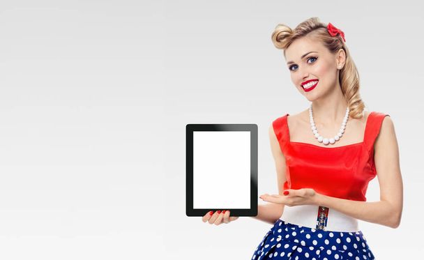 Woman, showing blank no-name tablet pc monitor, with copyspace - 写真・画像