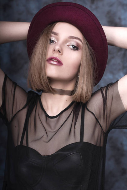 High fashion look, glamor stylish beautiful young woman model with red lips in hipster rock black cloth in boots. Retouched shot - Photo, Image