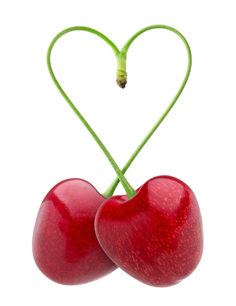 Isolated cherries. Heart shape from two cherries over white background - Photo, Image