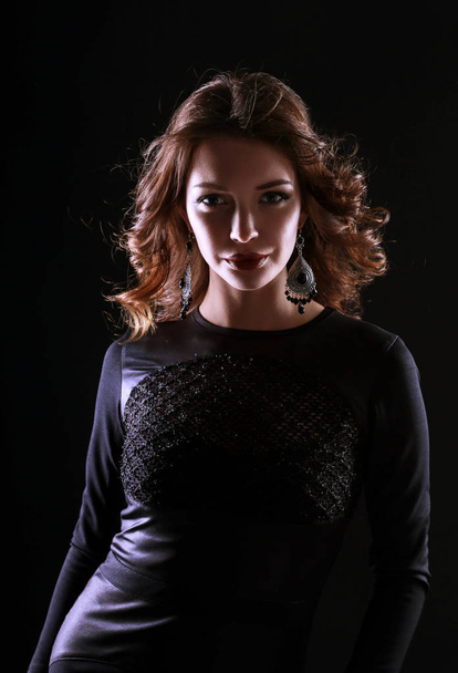 Beautiful woman with evening make-up in black dress - Foto, Bild