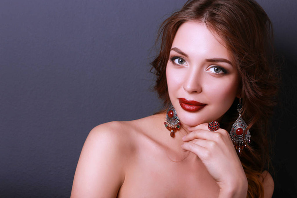 Beautiful woman with evening make-up in black dress - Fotografie, Obrázek