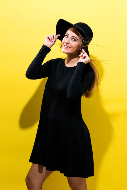 Happy young woman wearing a hat - Fotografie, Obrázek