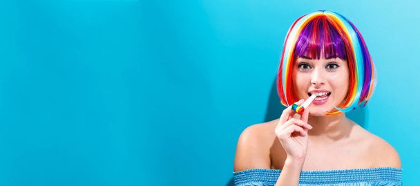 Beautiful woman in a colorful wig - 写真・画像