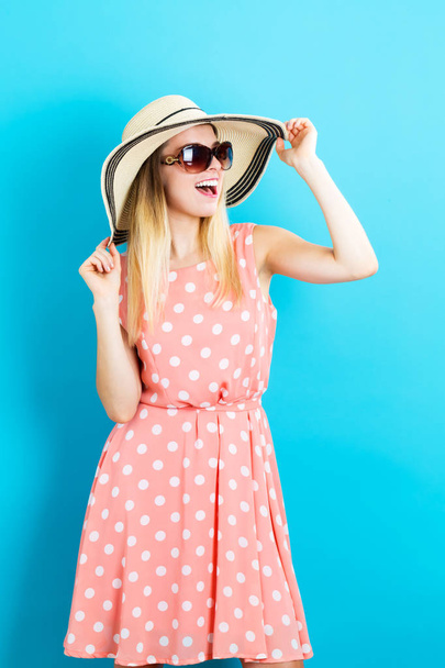 Happy young woman wearing a hat and sunglasses - Photo, Image