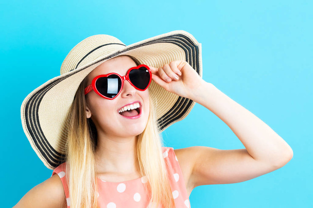 Happy young woman wearing hat and sunglasses - Φωτογραφία, εικόνα