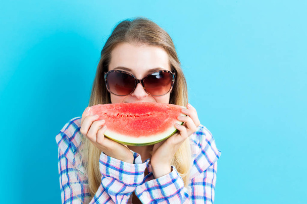 Happy young woman holding watermelon - Photo, image