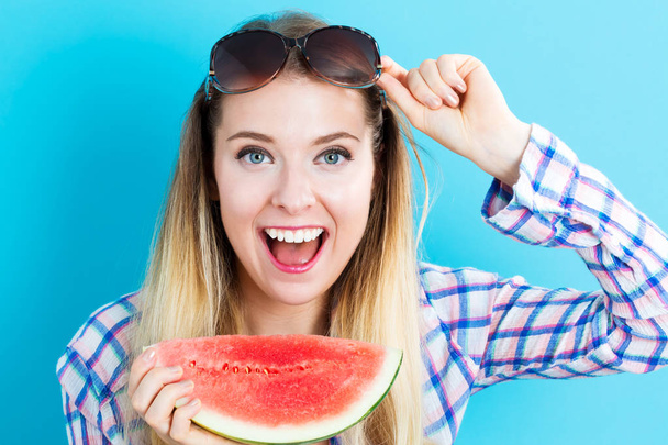 Happy young woman holding watermelon - Φωτογραφία, εικόνα