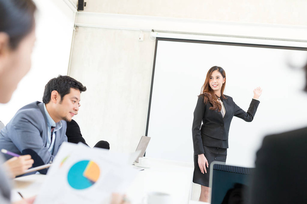Businesswoman make a presentation in meeting room - Фото, изображение