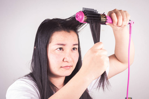 Women with hair rollers are serious about hair problems - Photo, Image