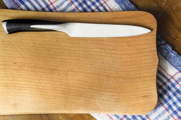 OLd wooden cutting board with knife - Photo, Image