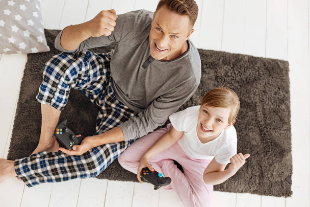 Admirable creative girl and her dad loving video games - Fotoğraf, Görsel