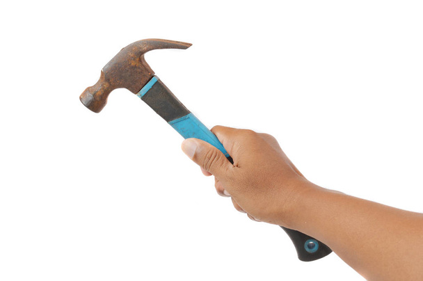 male hands holding a old used hammer on white background - Photo, Image