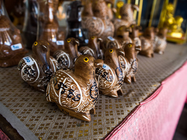 Beautiful wooden carved birds at market. - Photo, Image