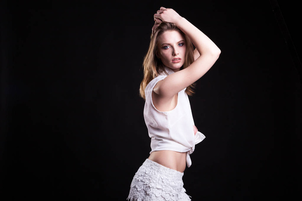 Seductive blonde model in white shirts on black background - Fotografie, Obrázek