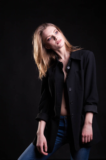 Gorgeous blonde in casual fashion clothes in studio photo - 写真・画像