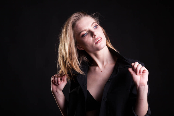 Beautiful blonde woman in casual fashion clothes in studio photo - Photo, image
