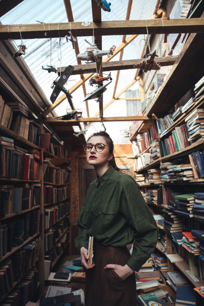 Portrait of woman with book looking camera - Fotografie, Obrázek