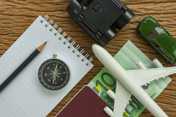 Travel planning concept with airplane, passport, compass, binocu - Фото, зображення